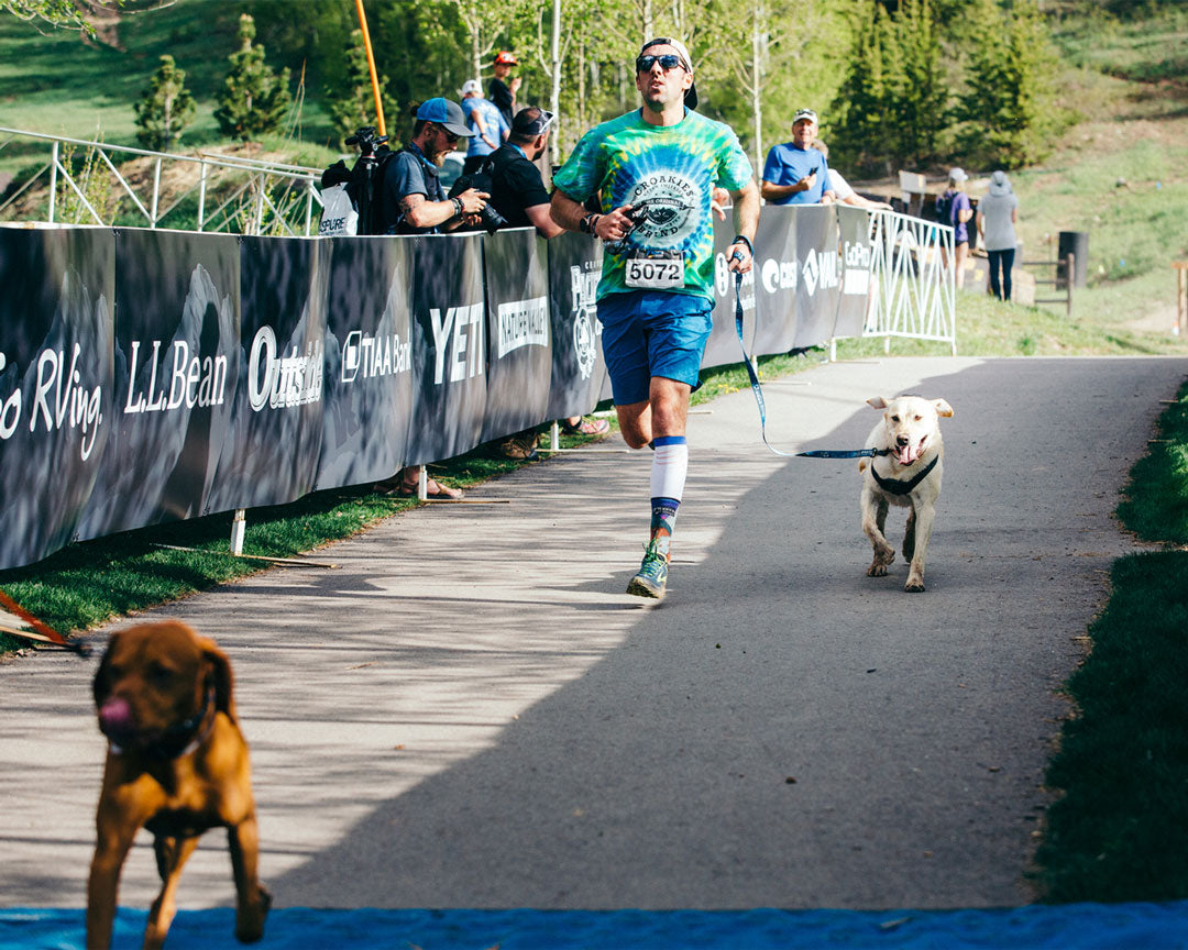 Men running a race with his dog