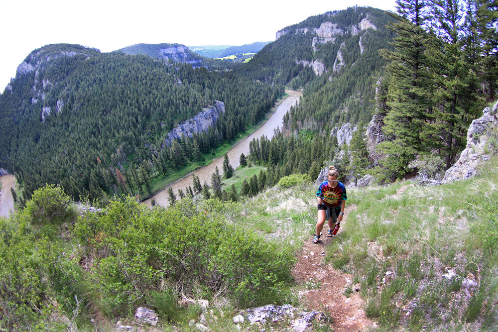 Women is hiking up a mountain