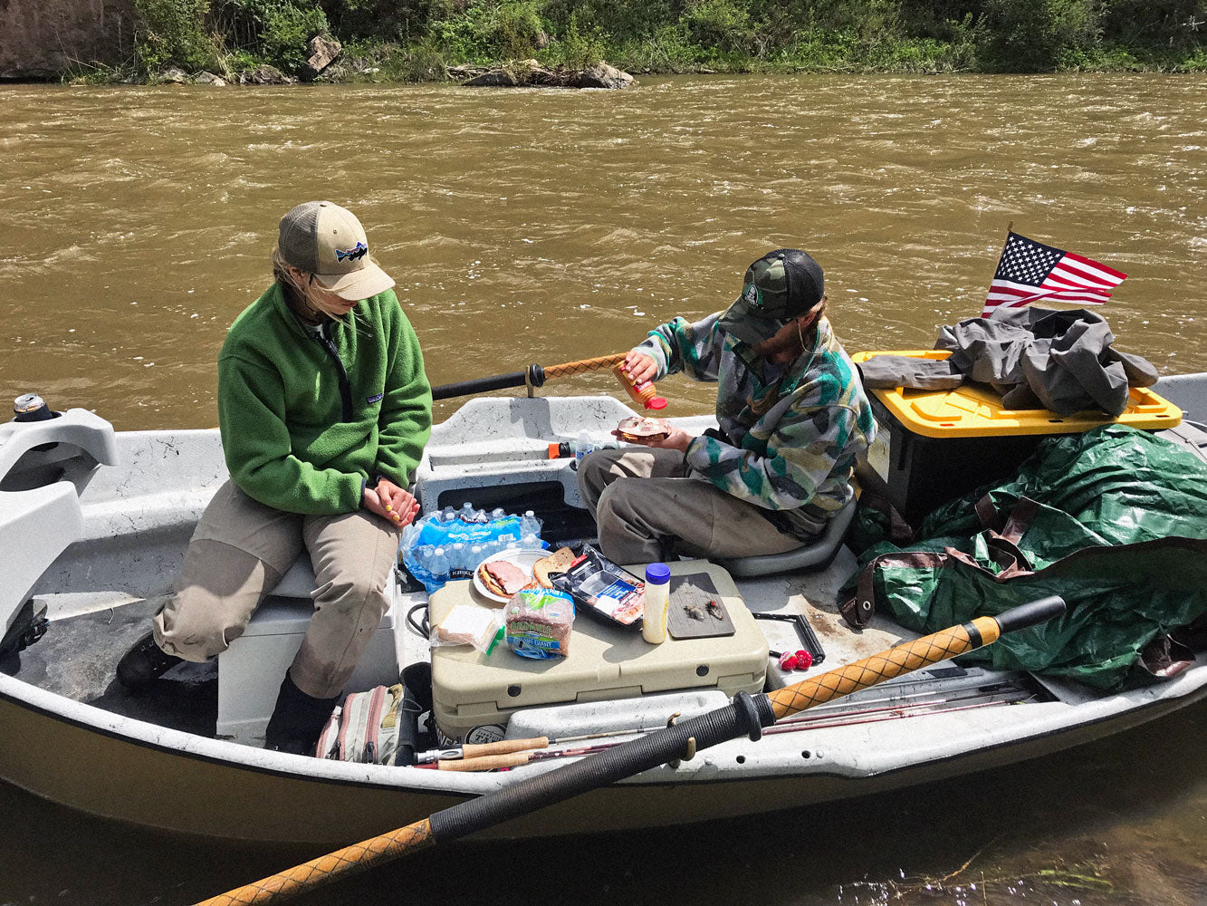 Two people are having lunch on a boat