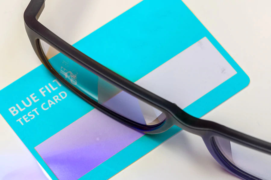 Glasses on a credit card to demonstrate blue light blocking
