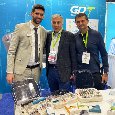 GDT Dental Implants team with happy clients at the GNYDM Greater New York International Dental Meeting 2023