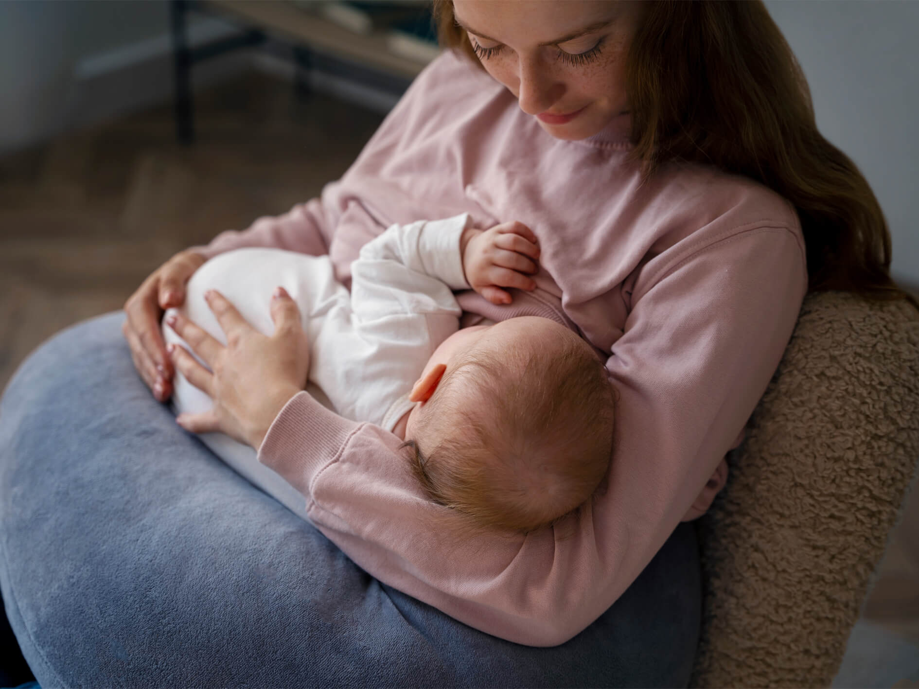 Mother is breastfeeding her baby