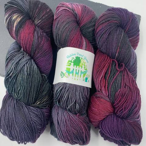 Silent Night, a purple, grey, and maroon yarn by Hidden Pond Yarns