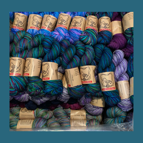 A box full of jewel toned yarns from Celtic Raven