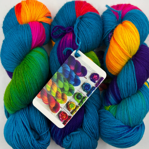 Blunicorn, a vibrant turquoise and rainbow yarn by Spun Ware Over the Rainbow