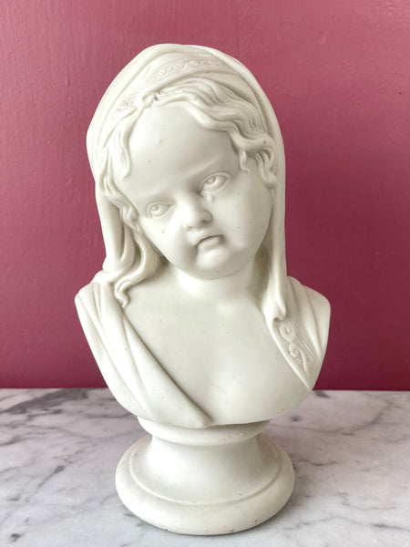 Victorian parian (unglazed white porcelain bisque) bust of a crying child