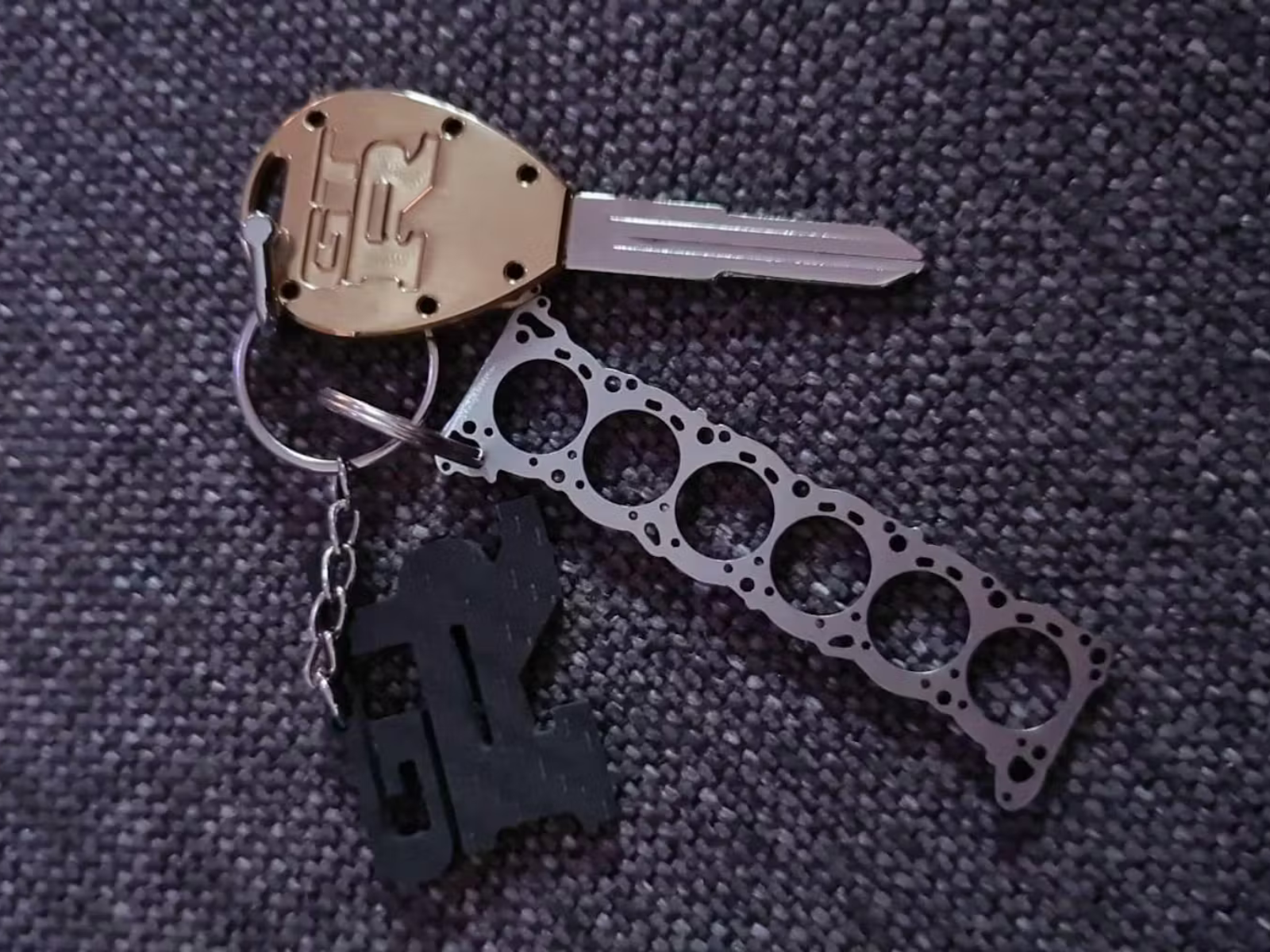 Miniatur einer Kopfdichtung für MX5 Edelstahl Schlüsselanhänger gebürstet –  DisagrEE