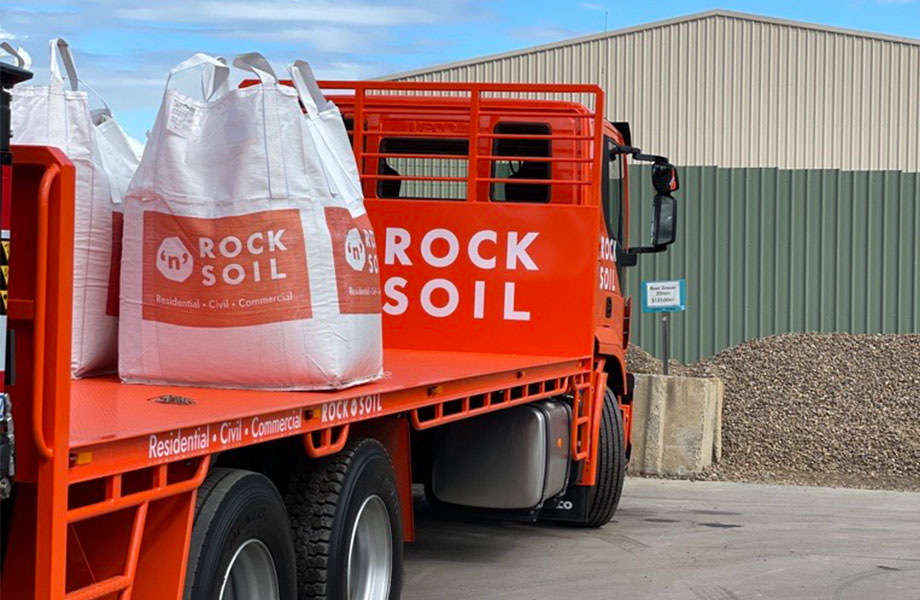 image of bulk bags with Rock N Soil written on them on the orange Rock N Soil truck