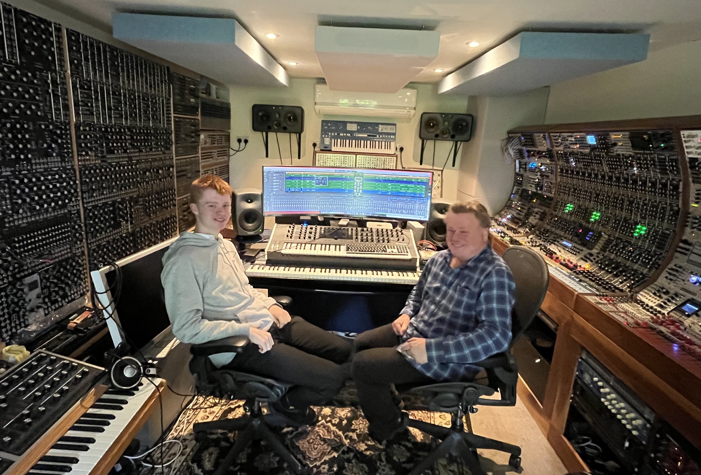 Teen composer Alfie Beston in a music studio with TV and film composer Lester Barnes