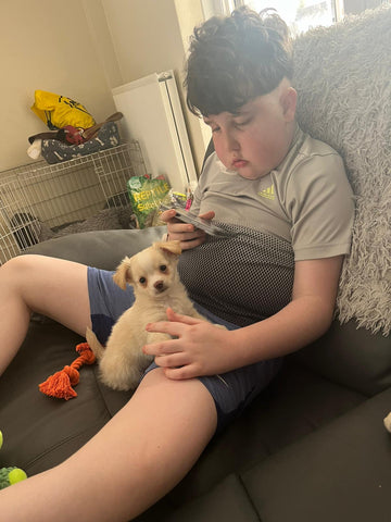 Charlie brain tumour patient holding a new pet dog