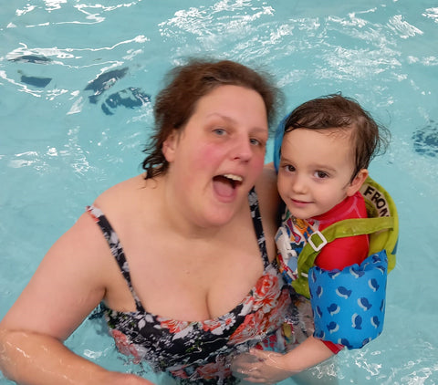 Clare with toddler Teddy swimming - brain tumour research
