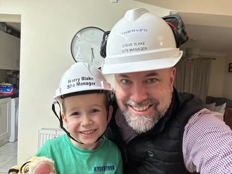 Steve and his son Harry wearing hard hats