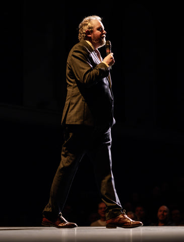 Comedian Miles Jupp on stage