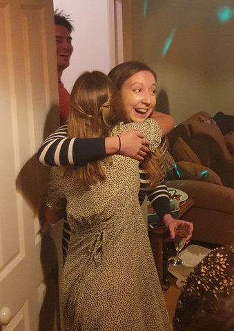 Rachel hugging her friend Lucy at her surprise party