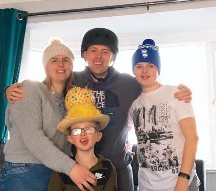 Paul Jeffries and his family taking part in Wear A Hat Day