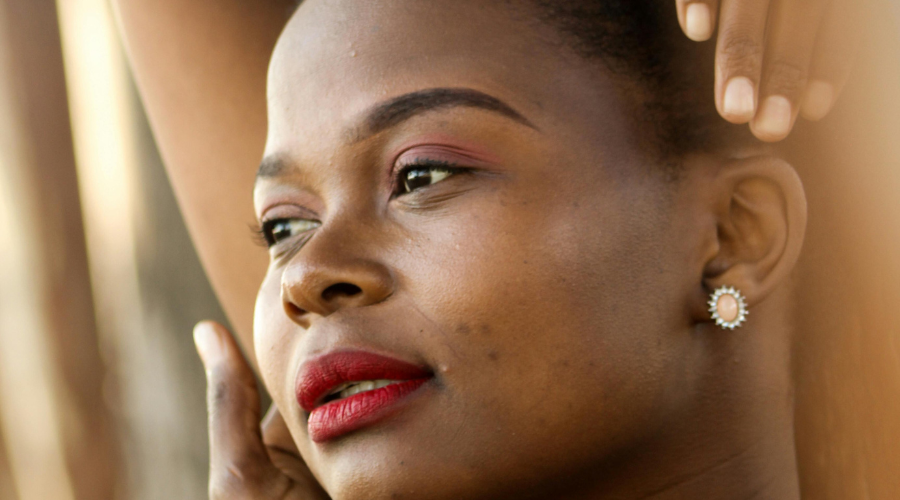 African American woman stretching her hands on her head