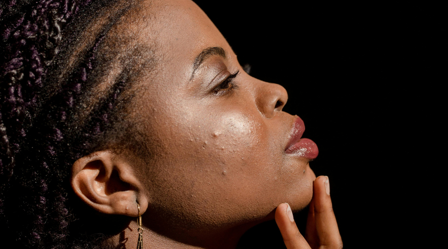 African American women with fingers on her chin