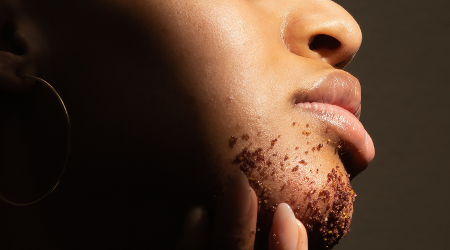 woman scrubbing her face