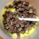 Stirring the chunks into the raw soap.