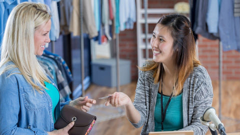 A retail employee helping a customer