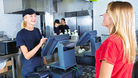Fast food employee helping a customer