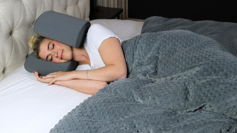 young woman sleeping peacefully while listening to white noise in her Soli pillow