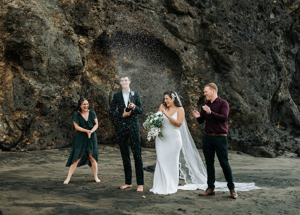 Newlywed couple celebrating their wedding with two of their friends!