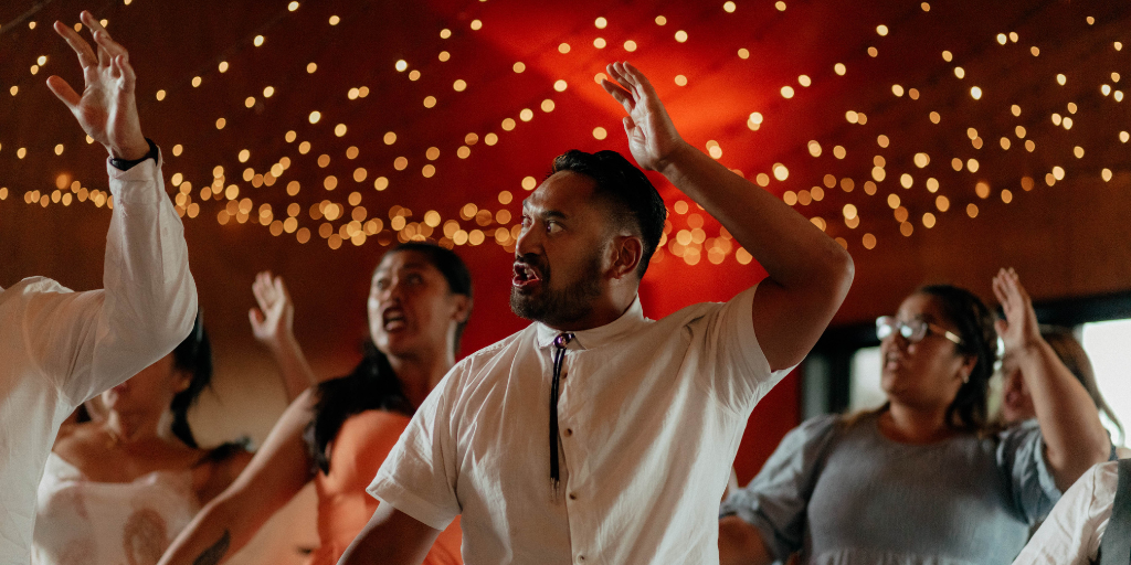 Maori culture under fairy lights at New Zealand wedding