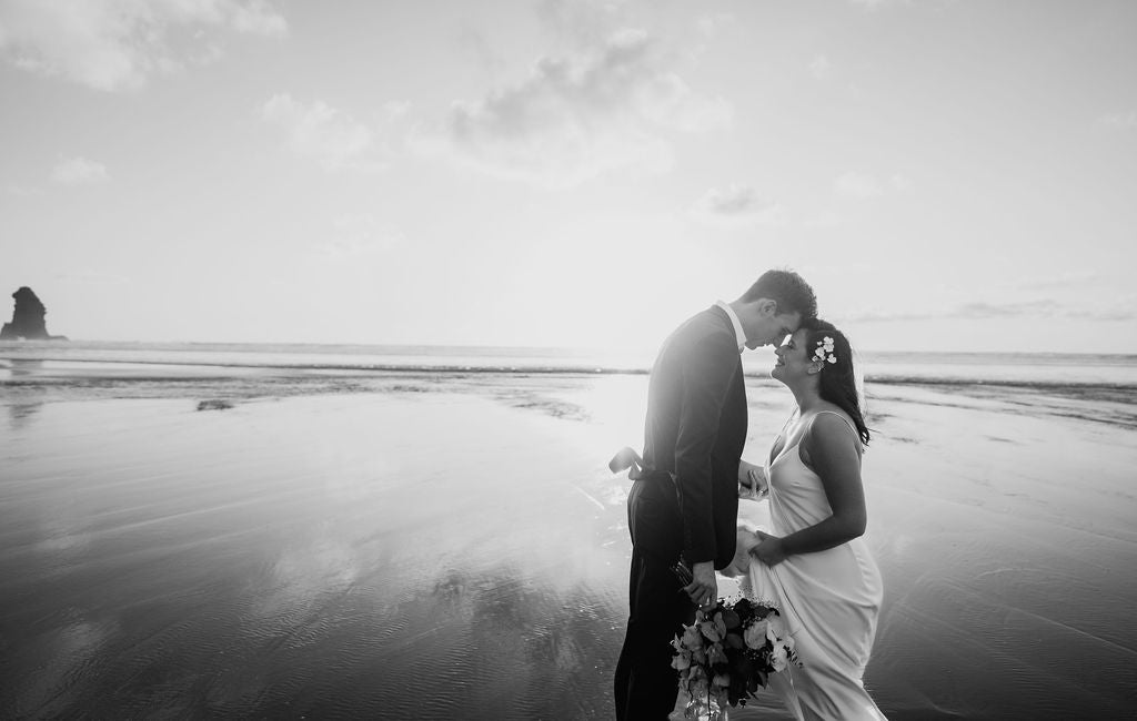 Newlyweds on beach