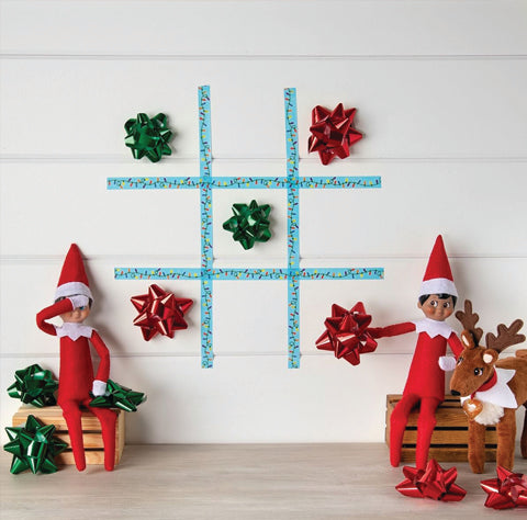 Two elves playing tic tac toe