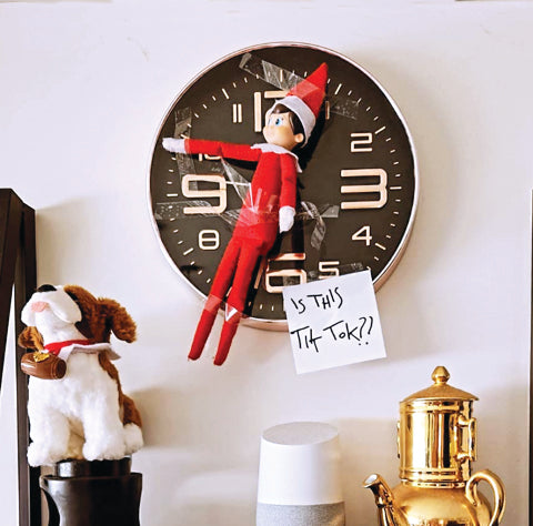 Elf stuck on clock. Tik Tok