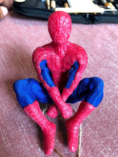Seated Spider-Man made from InstaMorph in full costume.