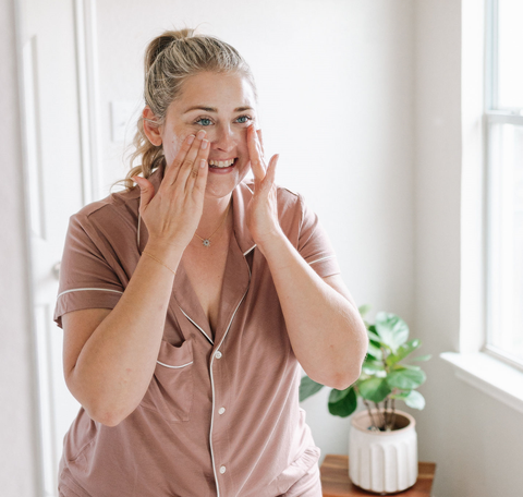 woman washing face natural cleanser