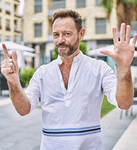 middle-age-man-outdoor-city-showing-pointing-up-with-fingers-number-seven-while-smiling-confident-happy_839833-25761.jpg__PID:ffe9082a-ab87-4d06-8f06-57dcc58e5c3d
