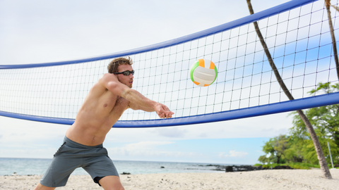 A man playing beach volleyball.