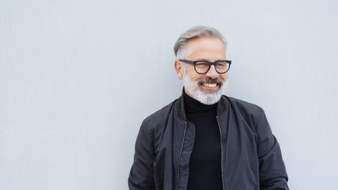 A gentlemen with grey facial hair and a grey boxed beard