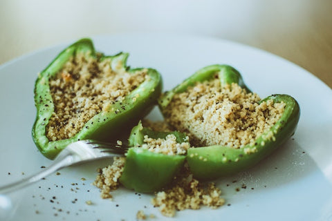 quinoa stuffed bell peppers are a nutritious meal you can create while camping for optimal nutrition