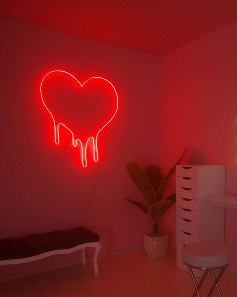 Red heart neon sign as decorative lighting fixture in home