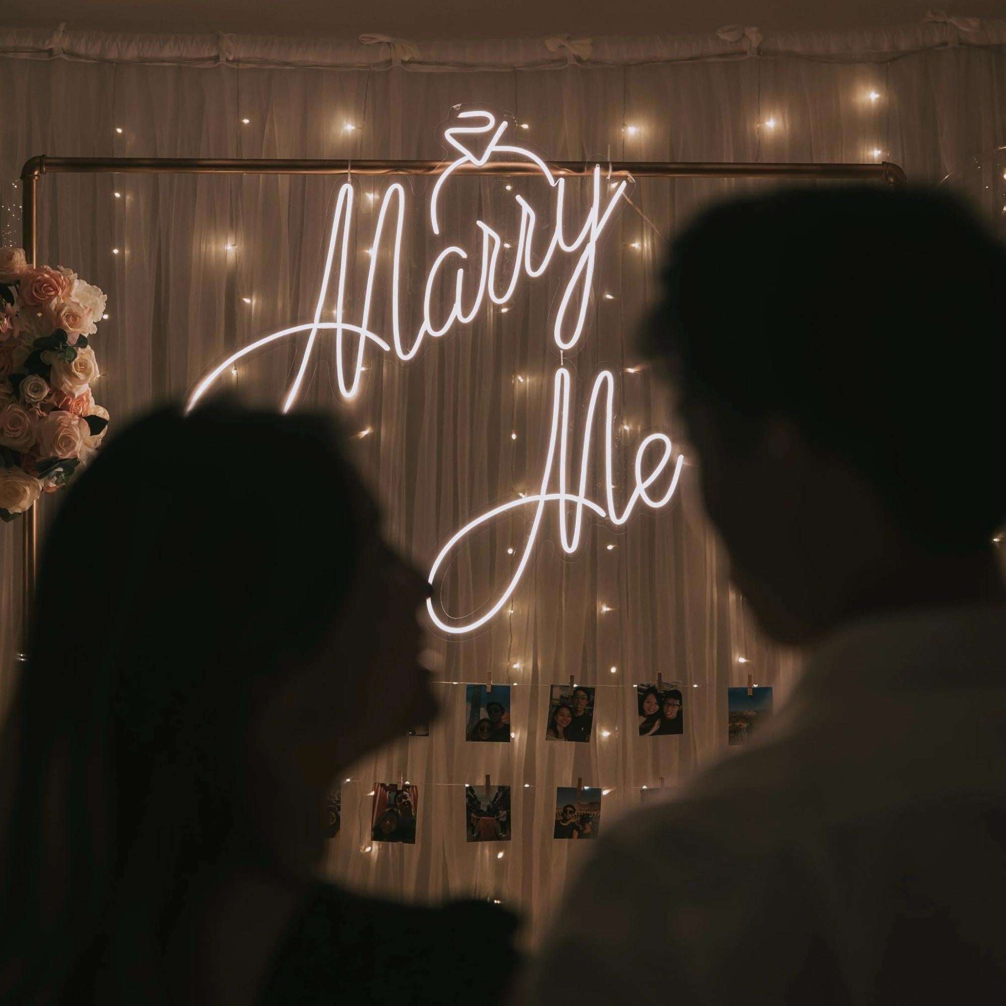A neon sign "Marry Me?" for the perfect proposal