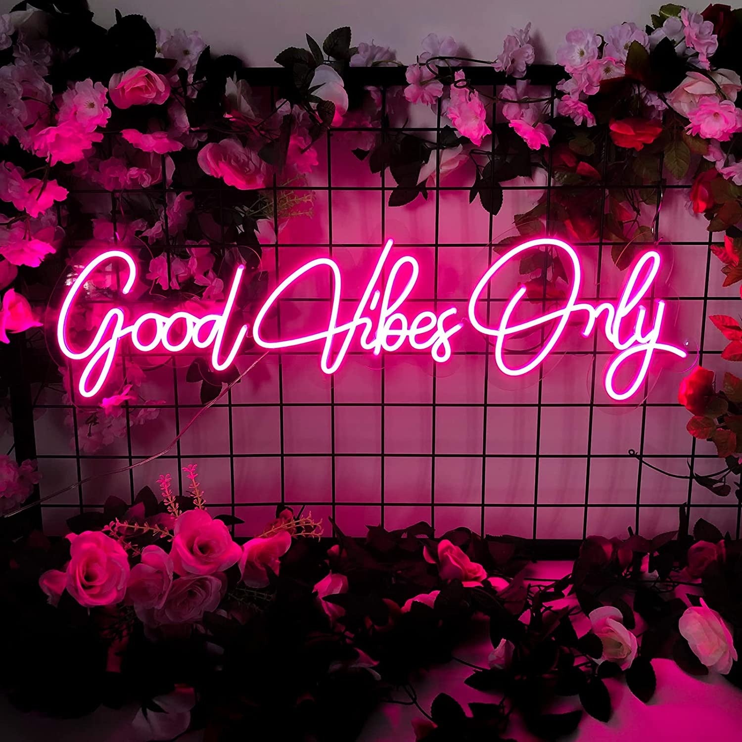 “Good Vibes Only” neon sign with pink warm tone
