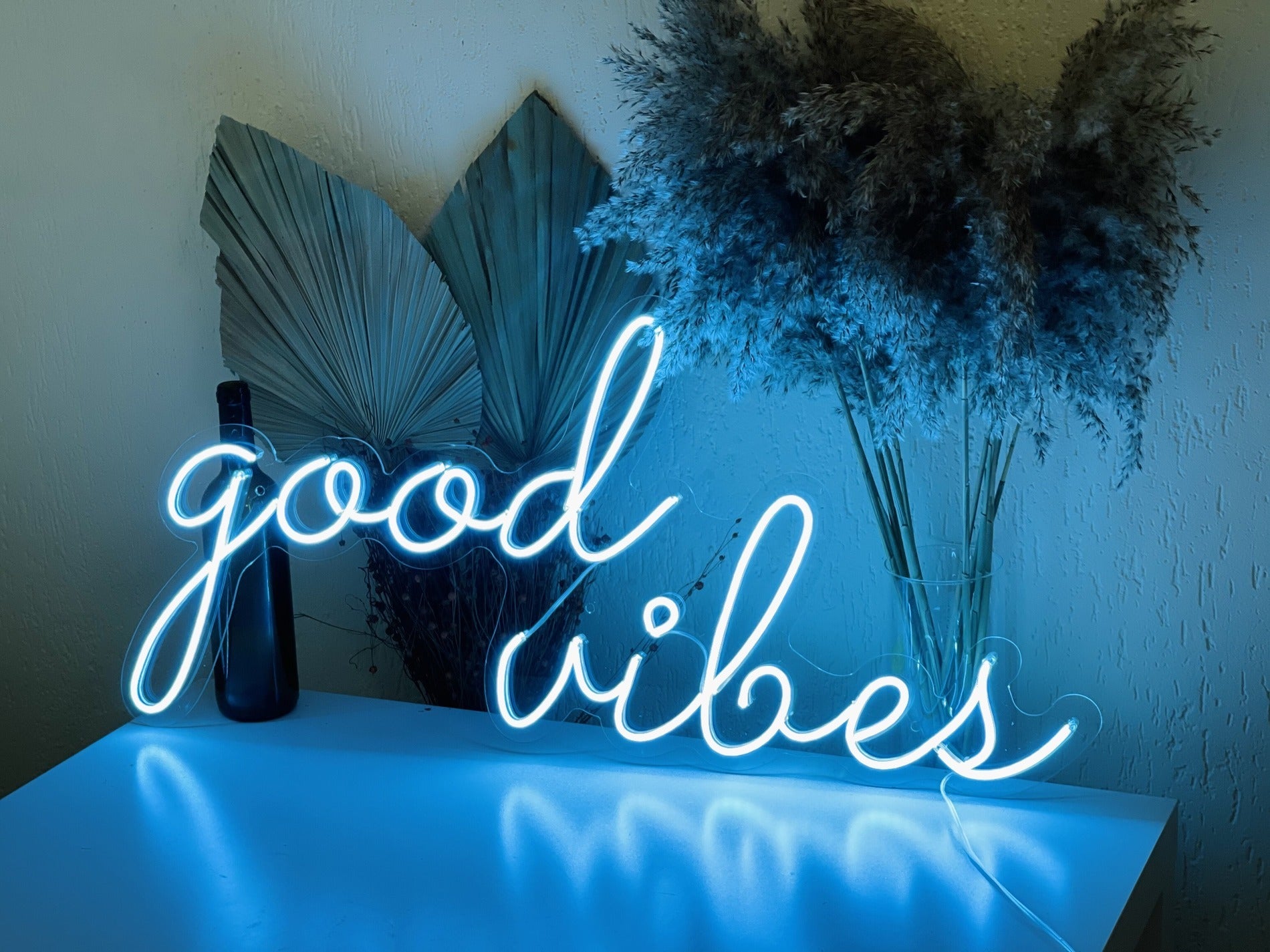 Cold blue tone "Good Vibes Only" neon sign