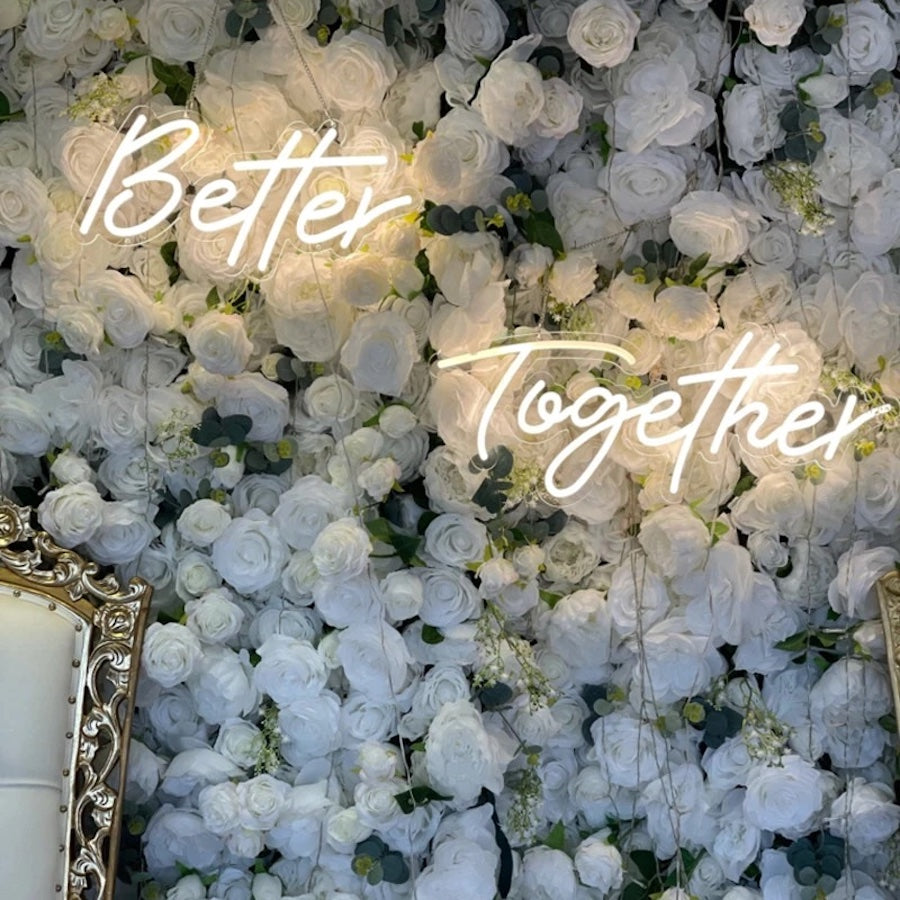 The Better Together wedding neon sign backdrop glows beautifully
