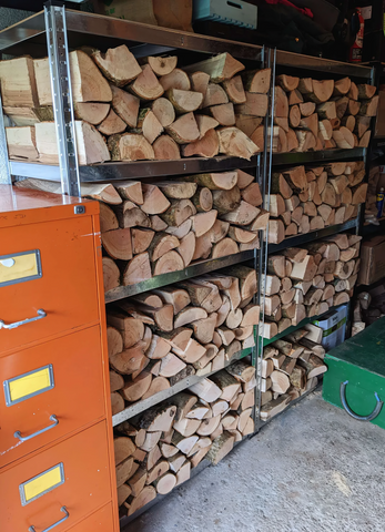 alt tag- an image of G-Rack shelving unit holding wooden logs in a garage