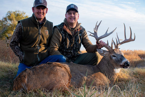 Isaac White and brother with a Big Kansas Whitetail