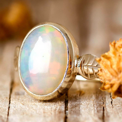 Sterling silver and precious genuine opal gemstone ring with leaf design available at boho magic