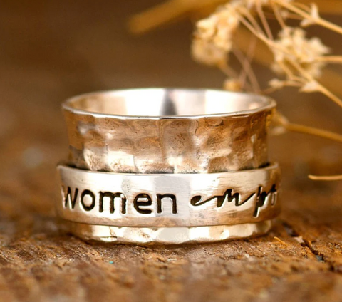 sterling silver spinner fidget ring that says 'women empower' fit for women available at boho magic