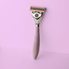 FFS chrome metal handle with purple rubber grip and a 6 blade razor head attached