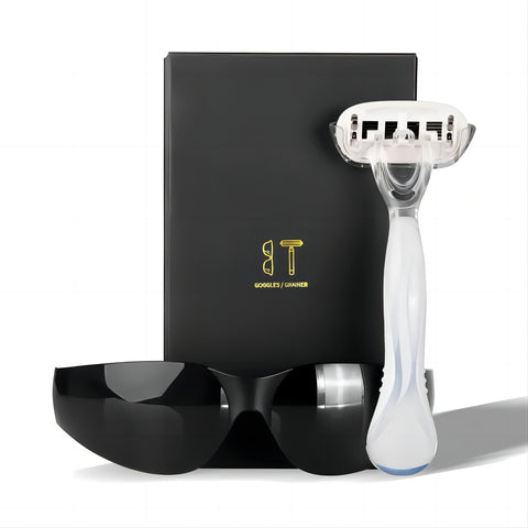 A sleek hair removal razor with protective goggles and elegant packaging, presented on a white background.