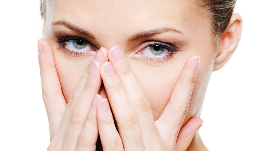 Close-up of a woman's face illustrating careful facial hair removal on sensitive skin.