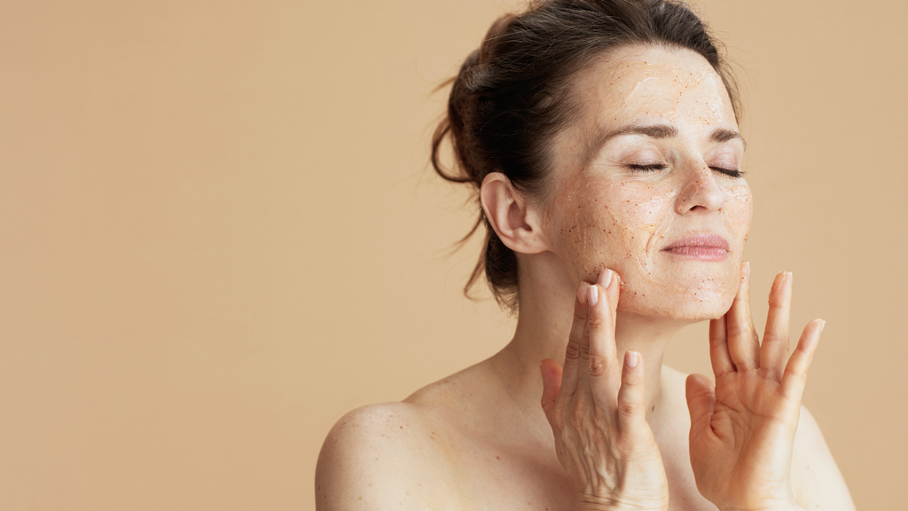 A woman is applying smoothing gel after ipl facial hair removal treatment